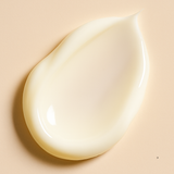 Glossy cream droplet on a beige background