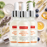 Three of Gymsegbe Luminous Mighty Punch Serum on a decorative background with plants and fruit extracts