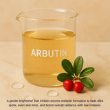 Glass beaker labeled arbutin with golden liquid, green leaves, and red berries on a marble surface.