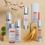 Full set of Korean skincare products including serums, toner, essence, moisturizer, SPF, and ginseng root on a beige background with cherry blossoms.