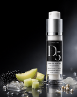 Gymsegbre Lumi D5 Matrix eye serum in a clear cylindrical bottle with a black label and white pump, styled on a reflective black surface with melon slices, black and white beads, and clear gel droplets.