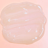 Luminous mighty punch serum swatch on a pink background