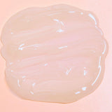 Luminous mighty punch serum swatch on a pink background