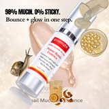 Gymsegba Power Bomb Essence skincare product with snail mucin and gold elements on a beige background.