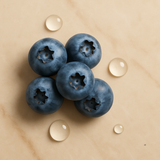 Blueberries with water droplets on a beige background
