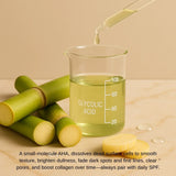 Glycolic acid in glass beaker with pipette, sugarcane stalks, and beige background