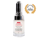 Dynamite Vitamin Serum bottle with a silver cap on a white background, featuring an award badge.