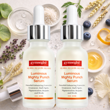 Two bottles of Gymsegbe Luminous Mighty Punch Serum with natural ingredients on a light background.