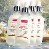 Four bottles of gymsegbe Luminous Mighty Punch Serum with a natural background.