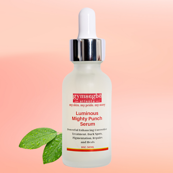 Luminous Mighty Punch Serum bottle with green leaf on a pink background