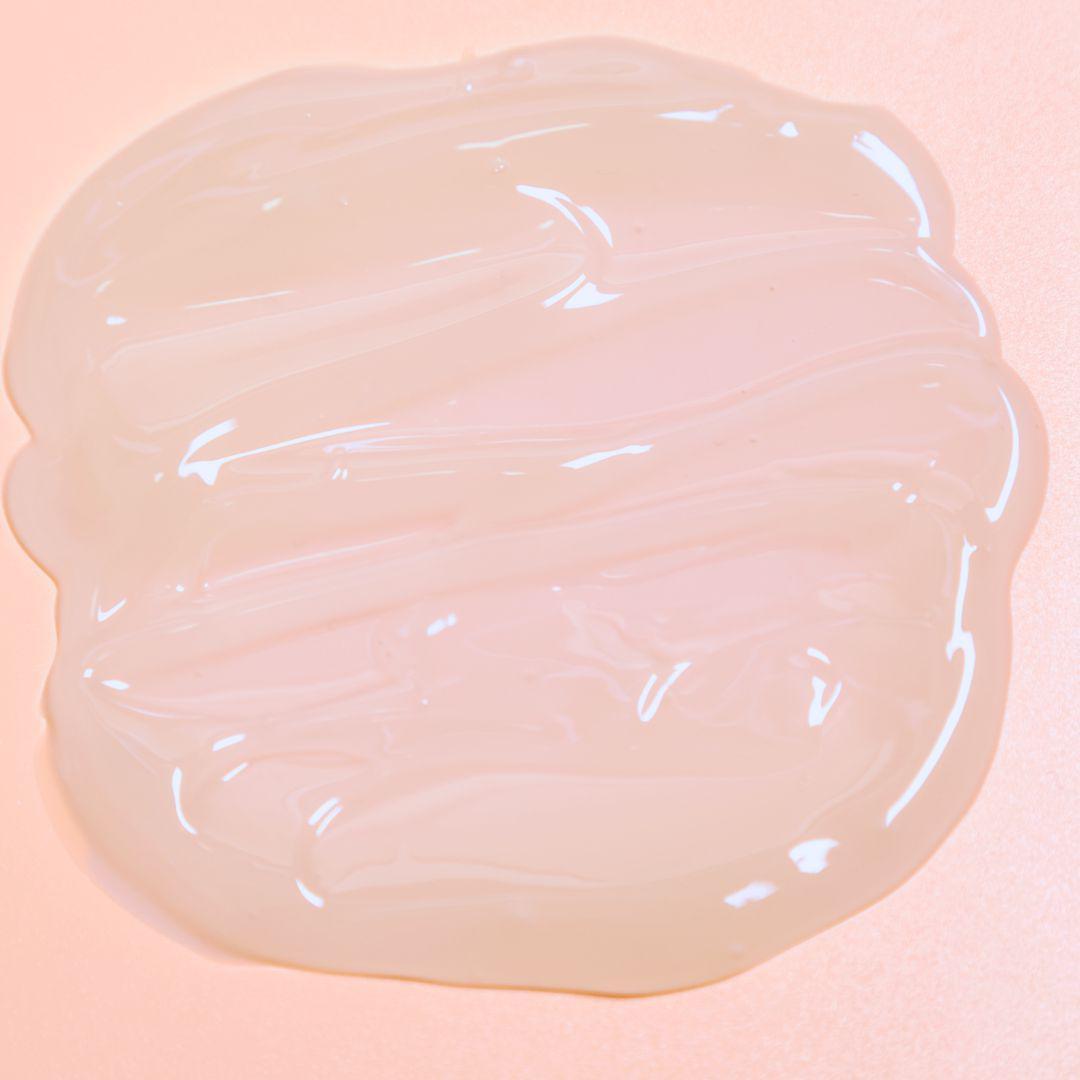 Luminous mighty punch serum swatch on a pink background 