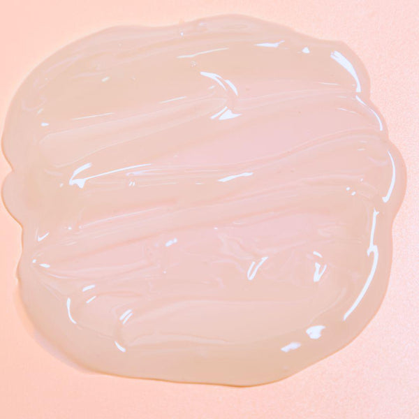 Luminous mighty punch serum swatch on a pink background 