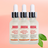 Three bottles of gymsegbe Korean Luminous Mighty Punch Serum on a peach background with green leaves.