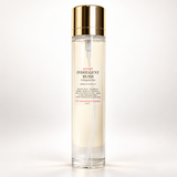 A clear cylindrical bottle of Gymsegbe INDULGENT BLISS Collagen Serum with a shiny gold cap, set against a clean white background.