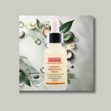 A bottle of Gymsegbe Luminous Mighty Punch Serum displayed against a background with floral elements, highlighting its skincare benefits.