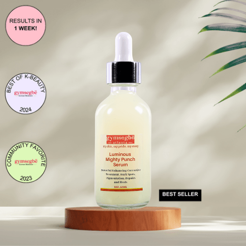 A bottle of Gymsegbe Luminous Mighty Punch Serum displayed against a background with floral elements, highlighting its skincare benefits. 60ml