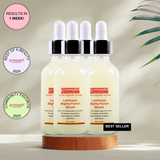A bottle of Gymsegbe Luminous Mighty Punch Serum displayed against a background with floral elements, highlighting its skincare benefits.
