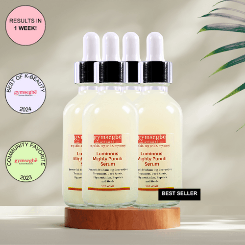 A bottle of Gymsegbe Luminous Mighty Punch Serum displayed against a background with floral elements, highlighting its skincare benefits.
