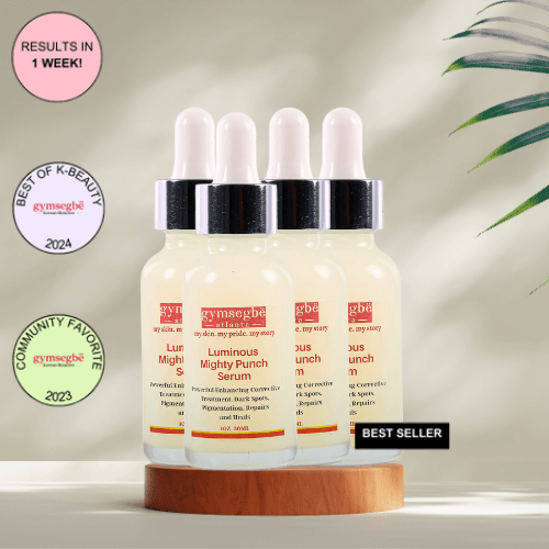 A bottle of Gymsegbe Luminous Mighty Punch Serum displayed against a background with floral elements, highlighting its skincare benefits.
