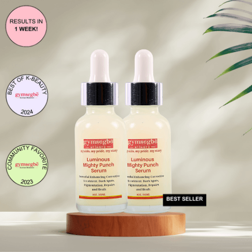 A bottle of Gymsegbe Luminous Mighty Punch Serum displayed against a background with floral elements, highlighting its skincare benefits.