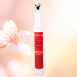 Skincare serum bottle with cherry blossoms on a gradient background
