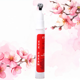 Red eye cream tube with cherry blossom design on a white background