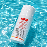 Sun protection face moisturizer bottle in a swimming pool