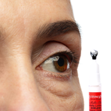 Close-up of an eye with a bottle of the new gymsegbe eye cream pump bottle with silver tip show casing how it can de-puff under eye bags